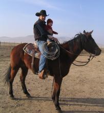 Austin Snedden getting help from his ranch hand